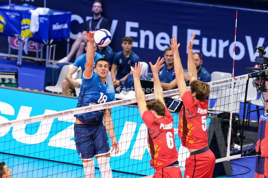 Klemen Cebulj of Slovenia (L), Simon Plaskie of Belgium (C) and Pieter Coolman of Belgium (R) during the Belgium vs Slovenia match at Quarter Final of the CEV Enel EuroVolley 2026 Men at PalaVela in Turin, Italy, on September 23, 2026. Belgium losts the match against Slovenia with a score 1-3