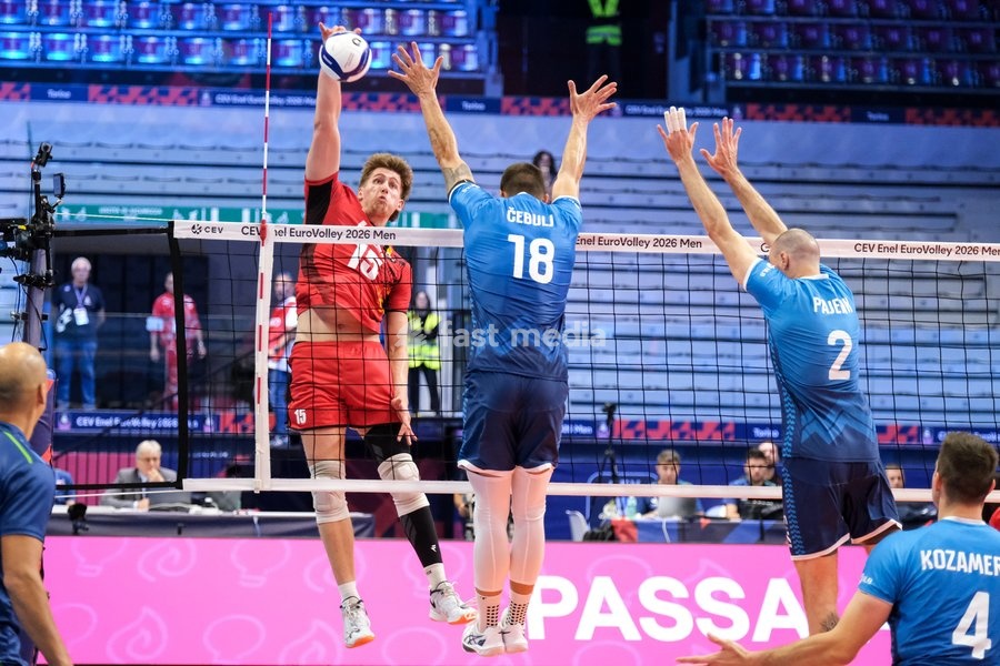 Basil Dermaux of Belgium (L), Klemen Cebulj of Slovenia (C) and Alen Pajenk of Slovenia (R) during the Belgium vs Slovenia match at Quarter Final of the CEV Enel EuroVolley 2026 Men at PalaVela in Turin, Italy, on September 23, 2026. Belgium losts the match against Slovenia with a score 1-3