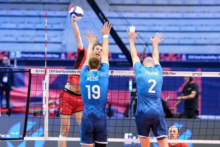Ferre Reggers of Belgium (L), Rok Možič of Slovenia (C) and Alen Pajenk of Slovenia (R) during the Belgium vs Slovenia match at Quarter Final of the CEV Enel EuroVolley 2026 Men at PalaVela in Turin, Italy, on September 23, 2026. Belgium losts the match against Slovenia with a score 1-3