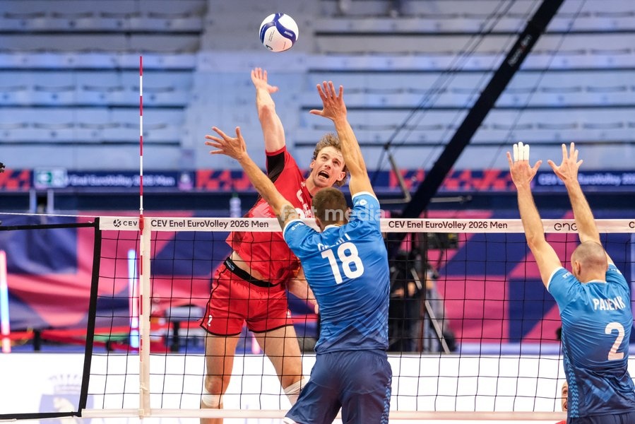 Ferre Reggers of Belgium (L), Klemen Cebulj of Slovenia (C) and Alen Pajenk of Slovenia (R) during the Belgium vs Slovenia match at Quarter Final of the CEV Enel EuroVolley 2026 Men at PalaVela in Turin, Italy, on September 23, 2026. Belgium losts the match against Slovenia with a score 1-3