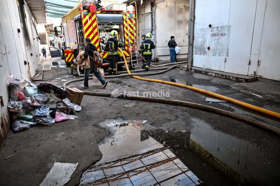 State Emergency Service workers roll out fire hoses to extinguish a fire at the Central Clothes Market (Anholenko) in Zaporizhzhia, Ukraine, September 26, 2026. The market sustained significant damage in a Russian drone attack