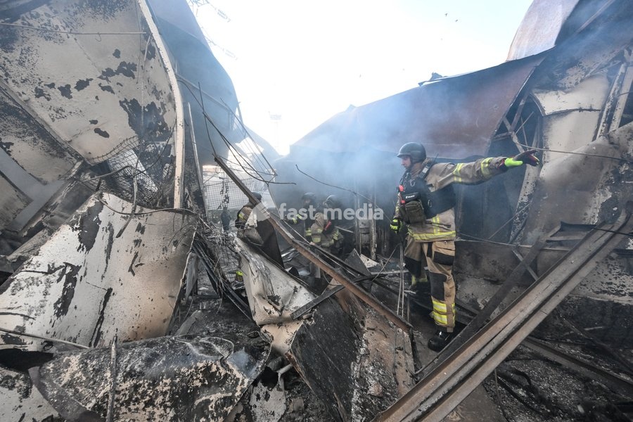 State Emergency Service rescuers work amid burnt-out metal containers at the Central Clothes Market (Anholenko) in Zaporizhzhia, Ukraine, September 26, 2026. The market sustained significant damage in a Russian drone attack