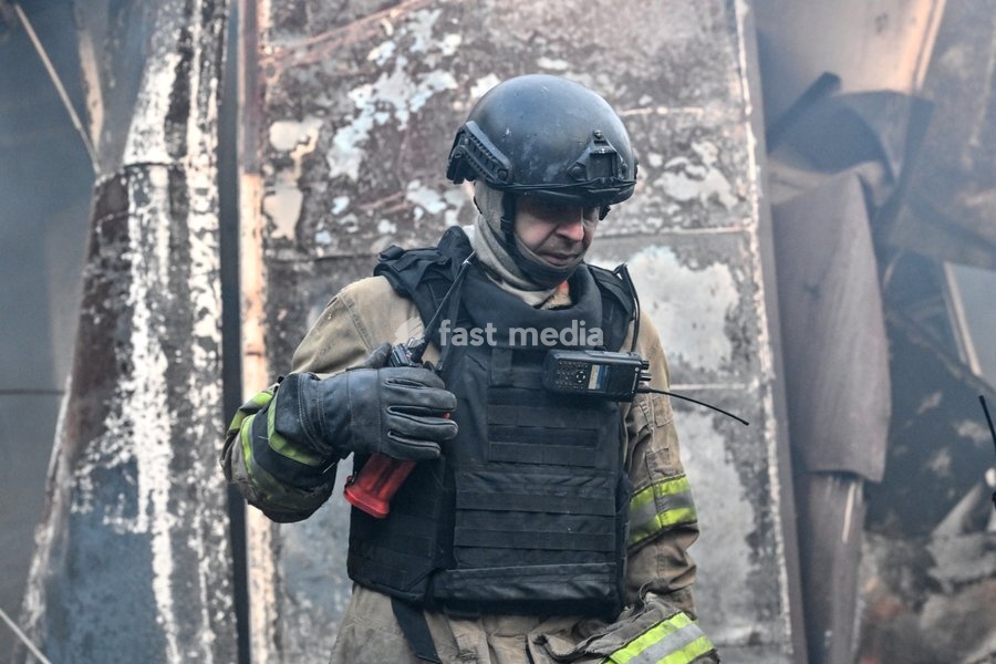 A State Emergency Service rescuer stands in front of damaged retail pavilions after the main hotspots of a fire were extinguished at the Central Clothes Market (Anholenko) in Zaporizhzhia, Ukraine, September 26, 2026. The market sustained significant damage in a Russian drone attack
