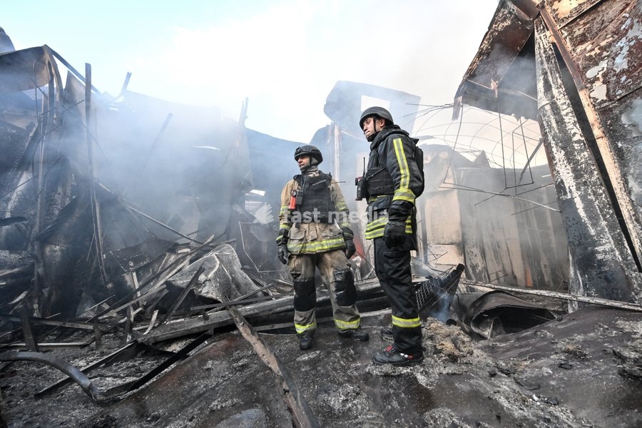 State Emergency Service rescuers work amid burnt-out metal containers at the Central Clothes Market (Anholenko) in Zaporizhzhia, Ukraine, September 26, 2026. The market sustained significant damage in a Russian drone attack