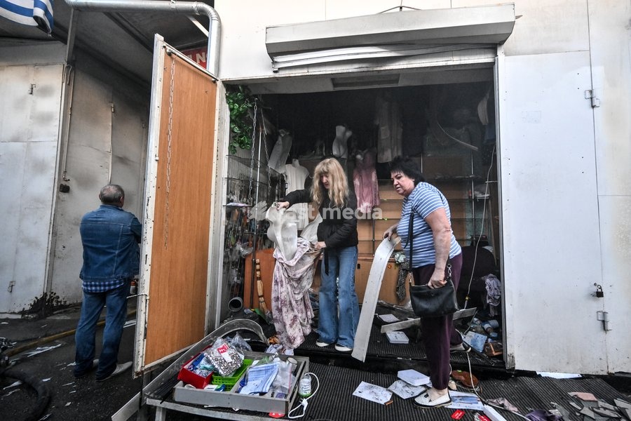 Entrepreneurs salvage goods from a retail pavilion at the Central Clothes Market (Anholenko) in Zaporizhzhia, Ukraine, September 26, 2026. The market sustained significant damage in a Russian drone attack