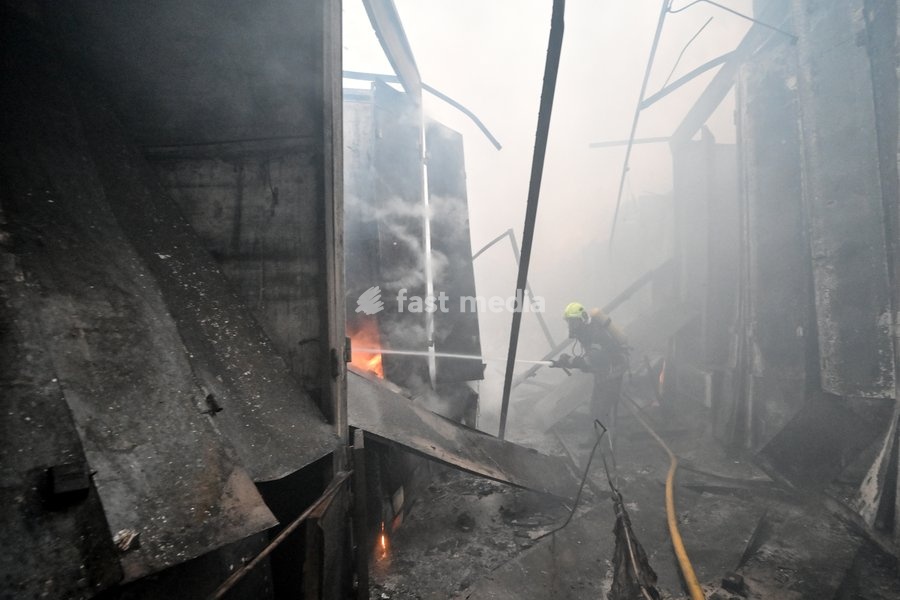 A State Emergency Service rescuer extinguishes a fire at the Central Clothes Market (Anholenko) in Zaporizhzhia, Ukraine, September 26, 2026. The market sustained significant damage in a Russian drone attack