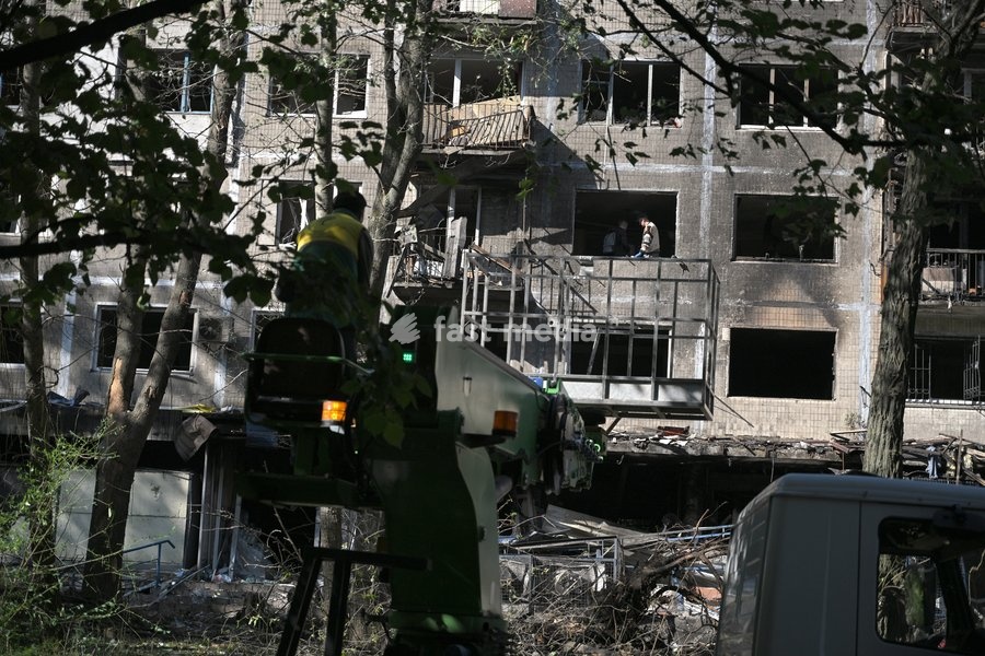 Municipal workers deal with the consequences of a Russian drone attack in the Solomianskyi district, Kyiv, Ukraine, September 26, 2026. During the morning assault on the capital, a Russian drone exploded close to the residential building. A fire covering 400 square metres broke out, destroying a…