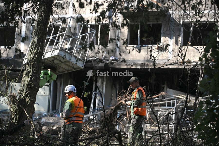 Municipal workers deal with the consequences of a Russian drone attack in the Solomianskyi district, Kyiv, Ukraine, September 26, 2026. During the morning assault on the capital, a Russian drone exploded close to the residential building. A fire covering 400 square metres broke out, destroying a…