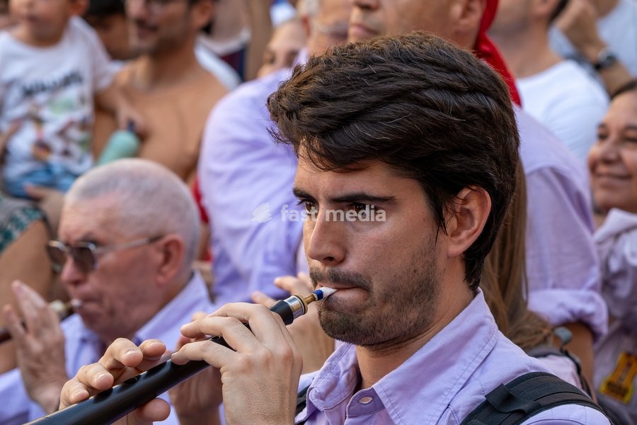 A musician of Castellers de Terrassa plays music to accompany the human tower construction during the traditional La Mercè festival celebrations, September 27, 2026, Plaça Sant Jaume, Barcelona, Catalonia