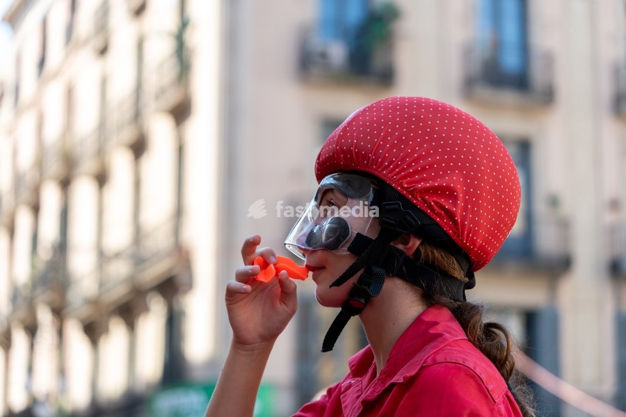 A young female member of Castellers de Barcelona wears a mouthguard for fall protection during the human towers performance at the traditional La Mercè festival celebrations, September 27, 2026, Plaça Sant Jaume, Barcelona, Catalonia