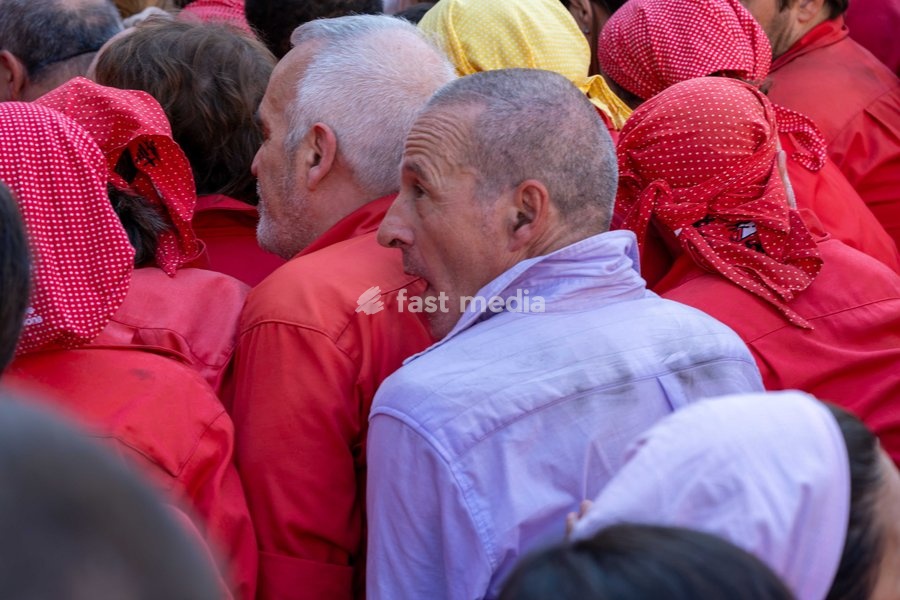 A member of Castellers de Terrassa helps Colla Jove dels Xiquets de Valls by forming part of the pinya base during the traditional La Mercè festival celebrations, September 27, 2026, Plaça Sant Jaume, Barcelona, Catalonia