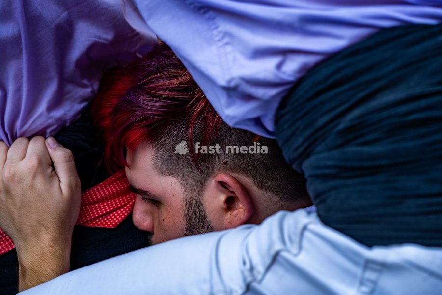 A member of Castellers de Terrassa helps Colla Jove dels Xiquets de Valls by forming part of the pinya base during the traditional La Mercè festival celebrations, September 27, 2026, Plaça Sant Jaume, Barcelona, Catalonia