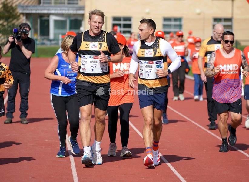 YORK, ENGLAND - SEPTEMBER 28: Lewis Moody and Sir Kevin Sinfield run around the track with MND supporters during the 7 in 7: The Grand Finale at the University of York Athletics Track on September 28, 2026 in York, England. Sir Kevin Sinfield is running an ultra marathon every day for seven days to…