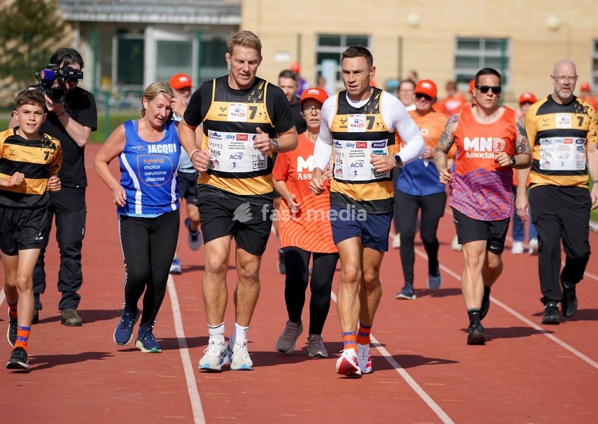 YORK, ENGLAND - SEPTEMBER 28: Lewis Moody and Sir Kevin Sinfield run around the track with MND supporters during the 7 in 7: The Grand Finale at the University of York Athletics Track on September 28, 2026 in York, England. Sir Kevin Sinfield is running an ultra marathon every day for seven days to…