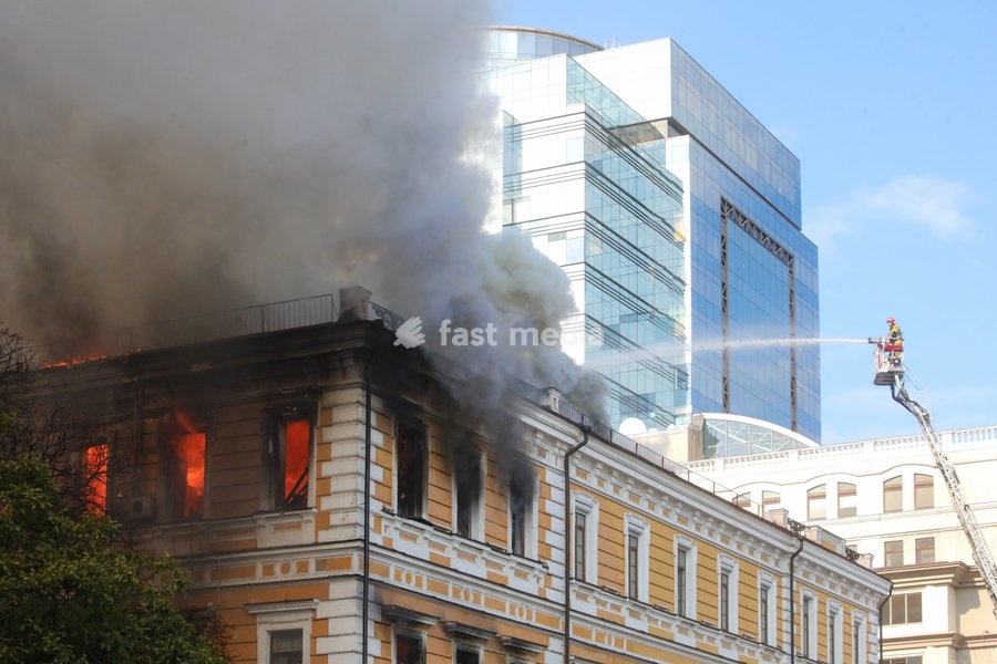 A rescuer uses an aerial work platform to extinguish a fire in the National Academy of Sciences building, which is engulfed in flames after being hit by a Russian drone, Kyiv, Ukraine, September 28, 2026. One person was killed, and three others were injured in the attack