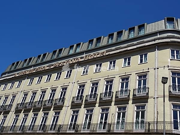 Brasileira Pestana Hotel building facade and windows under blue sky