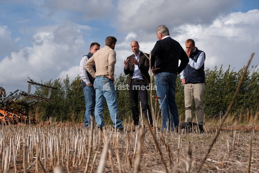 Britain's Prince William speaks with Regenified's Josh Fontenot and John Gregson, next to Harry Davies, the incoming tenant of the Duchy of Cornwall's first regenerative Farm Business Tenancy, during a visit to examine the role of regenerative farming in climate resilience in Hereford, Britain,…