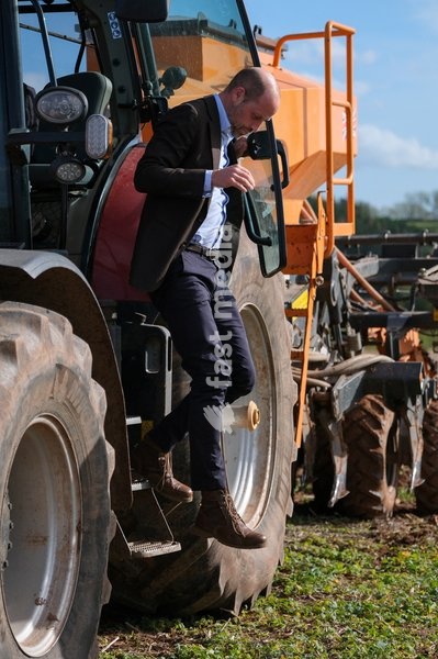Britain's Prince William steps off a farming vehicle as he meets Harry Davies (not pictured), the incoming tenant of the Duchy of Cornwall's first regenerative Farm Business Tenancy, during a visit to examine the role of regenerative farming in climate resilience in Hereford, Britain, October 1,…