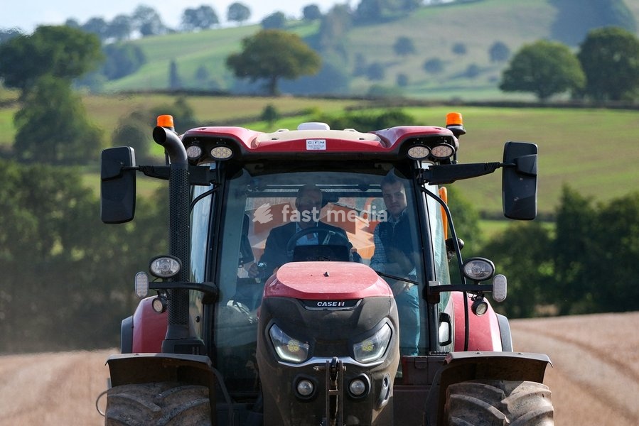 Britain's Prince William drives a farming vehicle with Harry Davies, the incoming tenant of the Duchy of Cornwall's first regenerative Farm Business Tenancy, during a visit to examine the role of regenerative farming in climate resilience in Hereford, Britain, October 1, 2026