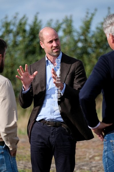 Britain's Prince William speaks with Regenified's Josh Fontenot and John Gregson, as he visits Harry Davies (not pictured), the incoming tenant of the Duchy of Cornwall's first regenerative Farm Business Tenancy, during a visit to examine the role of regenerative farming in climate resilience in…