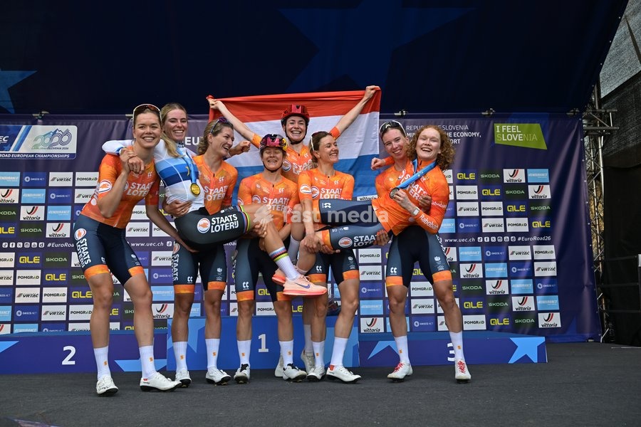 European champion Netherlands' Demi Vollering (L) and vice-champion Netherlands' Puck Pieterse (R) celebrate on the podium with their team after the podium of the elite women Road Race race (130 km) at the cycling UEC Road European Championships, in Ljubljana, Slovenia Saturday 3 October 2026. The…