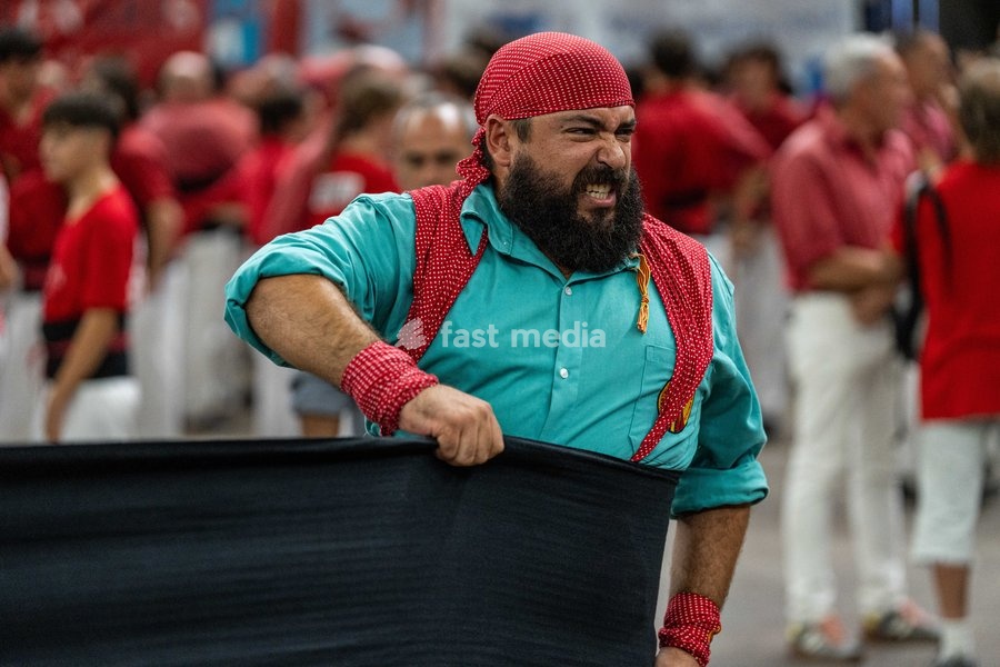 Member of the Sagrada Familia colla prepare to take part in the Concurs de Castells competition in Tarragona, Spain, on October 3, 2026