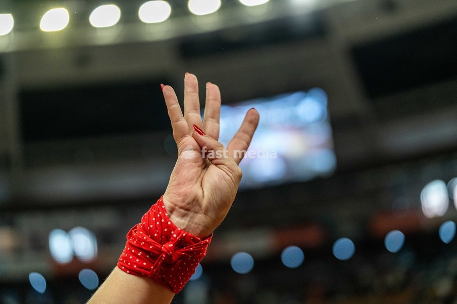 A woman makes the sign of the four bars of blood of the Catalan flag during the Concurs de Castells competition in Tarragona, Spain, on October 3, 2026