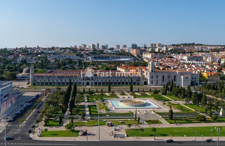 Lisbon, Portugal – View of Jerónimos Monastery and Praça do Império gardens on a clear afternoon