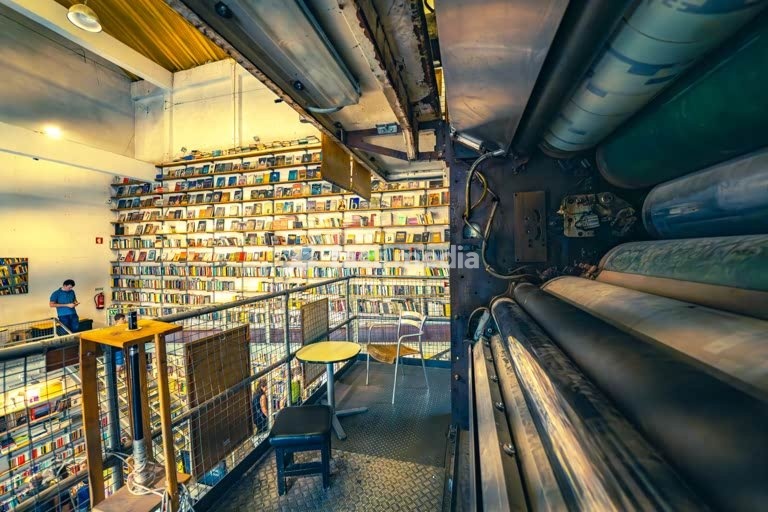 Bookstore Ler Devagar in Lisbon’s LX Factory, a former newspaper print factory, now cultural hotspot, with books, vinyl records, historic machinery