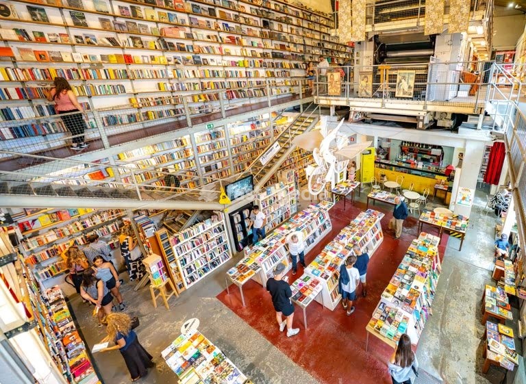 Bookstore Ler Devagar in Lisbon’s LX Factory, a former newspaper print factory, now cultural hotspot, with books, vinyl records, historic machinery