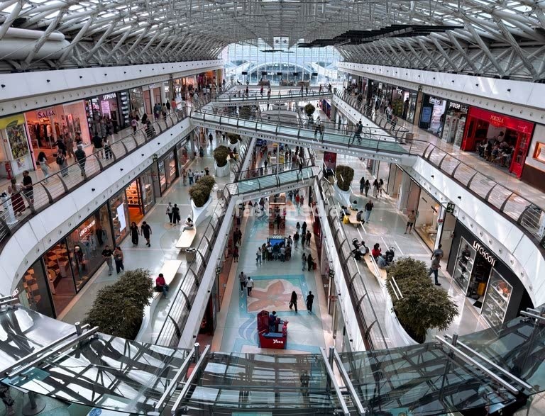 Oriente shopping mall atrium, modern steel glass architecture, escalators and canopy, Parque das Nações, Lisbon, Portugal