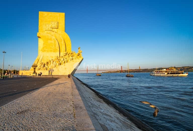 Monument to the Discoveries on Tagus River with 25 de Abril Bridge, Belém, Lisbon, Portugal