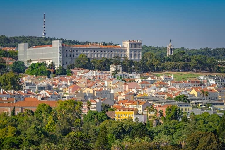 Ajuda Palace overlooking residential neighborhoods and green hills, Lisbon, Portugal