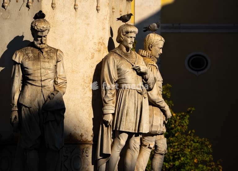 Lisbon, Portugal stone figures at the base of the Camões monument in warm late afternoon light. Photo Peter Delius