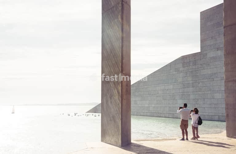Lisbon, Portugal – Couple photographing the waterfront at Champalimaud Foundation