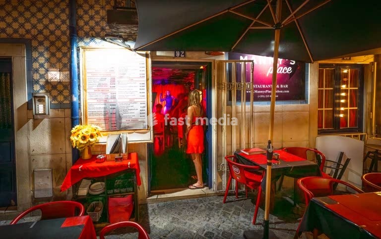 Secret Lisbon, Portugal: drag performer on a small club stage along Rua da Barroca at night