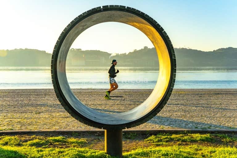 Jogger at Tagus River sunrise – Lisbon Belem Portugal modern minimalist scene