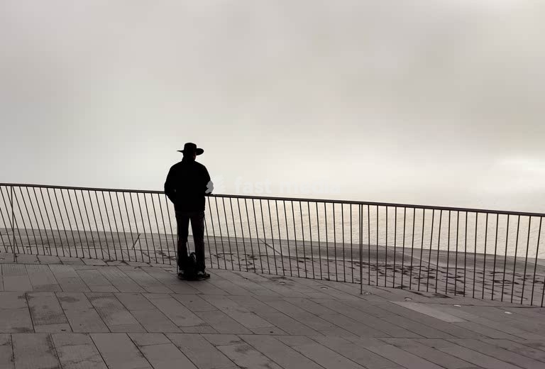 Solitary figure on MAAT Museum rooftop, Lisbon Belem Portugal – minimalist emptiness and philosophical mood on a foggy day