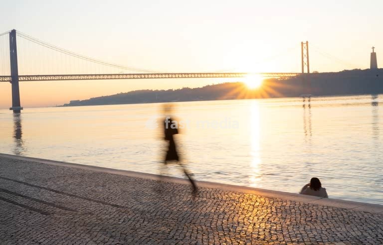 Jogger at Tagus River sunrise – Lisbon Belem Portugal modern minimalist scene