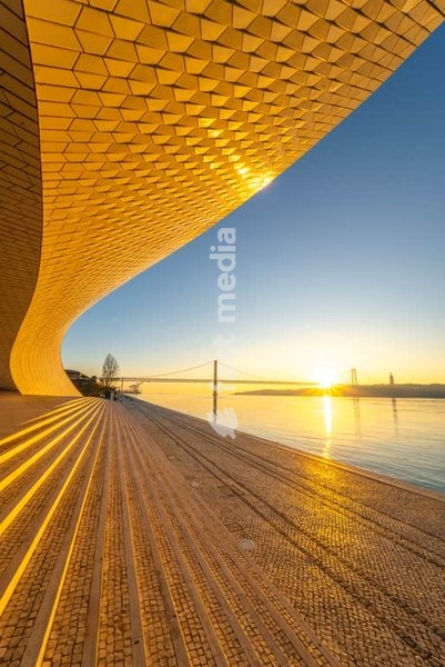 MAAT Museum curvilinear facade at sunrise, Tagus River Lisbon Belem Portugal – contemporary architecture