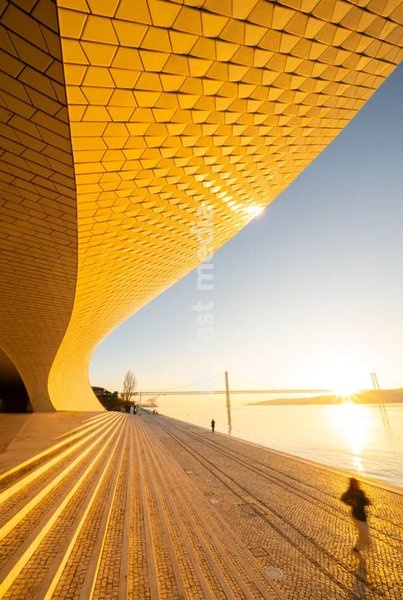 MAAT Museum curvilinear facade at sunrise, Tagus River Lisbon Belem Portugal – contemporary architecture
