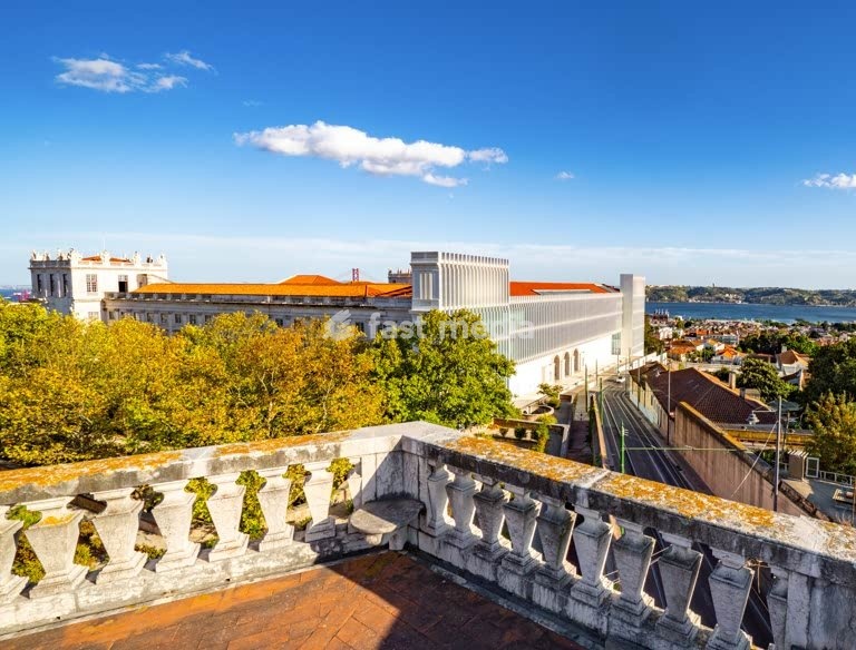Ajuda Palace (Palacio National da Ajuda) overlooking residential neighborhood Ajuda and Belém and Tagus river, Lisbon, Portugal