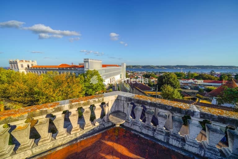 Ajuda Palace (Palacio National da Ajuda) overlooking residential neighborhood Ajuda and Belém and Tagus river, Lisbon, Portugal