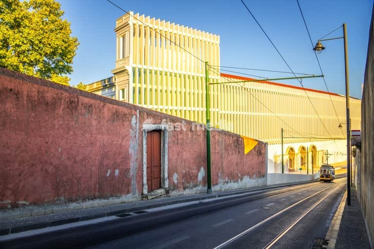 Palacio National da Ajuda, Lisbon. The last Royal Palace of Portugal, built 1802-1861/2018. New facade. Yellow tram passing