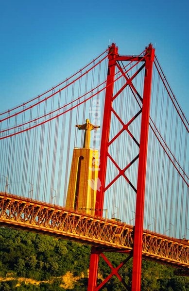 Bridge Ponte 25 de Abril across Tagus river and statue Cristo Rei, Lisbon, Portugal