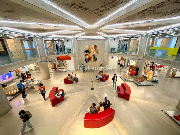 MUDE museum interior, vintage chair, industrial ceiling, fashion exhibit, Lisbon, Portugal