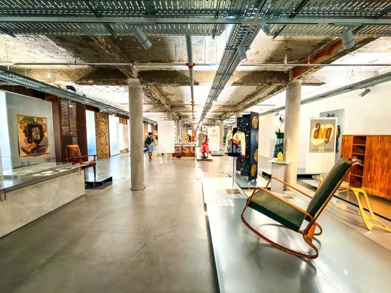 MUDE museum interior, vintage chair, industrial ceiling, fashion exhibit, Lisbon, Portugal