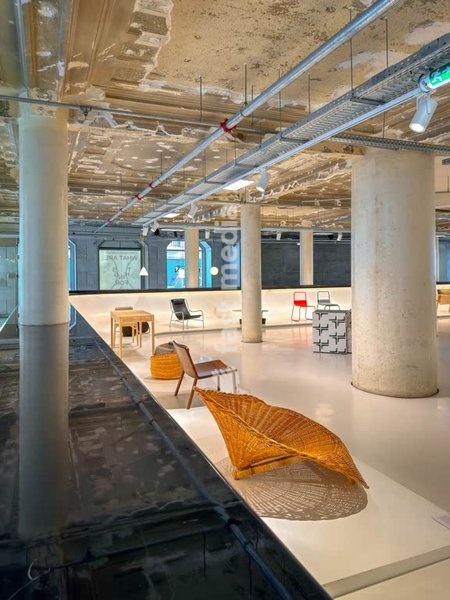 MUDE museum interior, vintage chair, industrial ceiling, fashion exhibit, Lisbon, Portugal