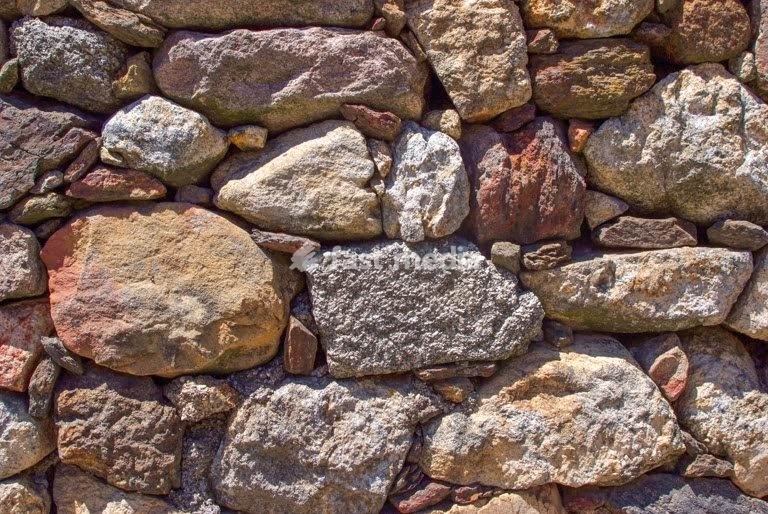 Dry-stone wall, rural architecture, granite masonry in Alentejo, Portugal, authentic countryside heritage texture
