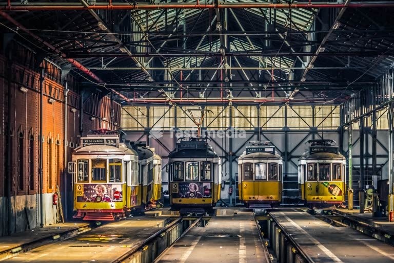 Lisbon, Portugal, tram depot with preserved yellow trams inside Carris maintenance workshop and museum
